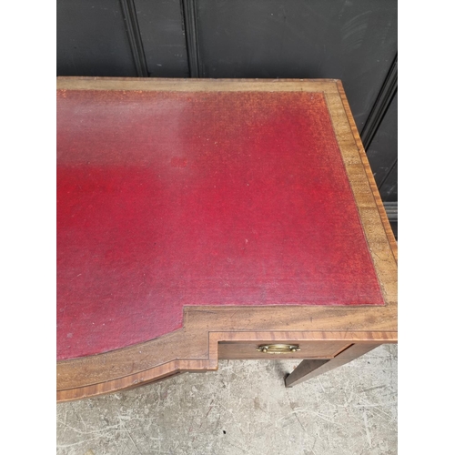 1055 - A circa 1900 mahogany and inlaid bowfront writing table, 107cm wide.