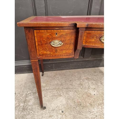 1055 - A circa 1900 mahogany and inlaid bowfront writing table, 107cm wide.