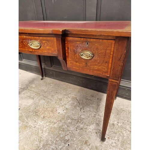 1055 - A circa 1900 mahogany and inlaid bowfront writing table, 107cm wide.