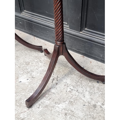 1057 - A pair of Regency style mahogany octagonal tripod tables, 37.5cm wide.