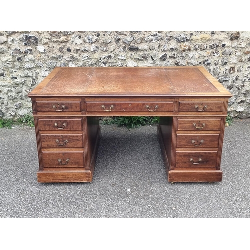 1060 - An early 20th century mahogany partners' pedestal desk, with drawers to each opposing side, 152.5 x ... 