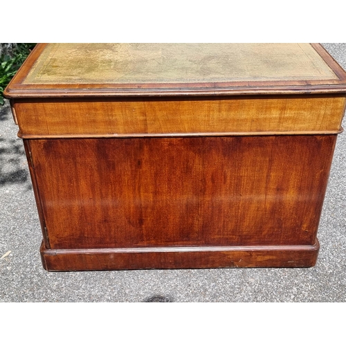 1061 - A Victorian mahogany partners' pedestal desk, with cupboards to one opposing side, 151.5 x 105cm.... 