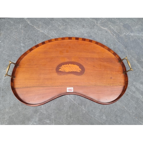 1062 - An Edwardian mahogany and inlaid kidney shaped tray, 60.5cm wide.