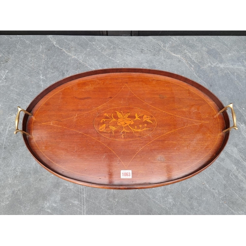 1063 - An Edwardian mahogany and inlaid oval tray, 64cm wide.