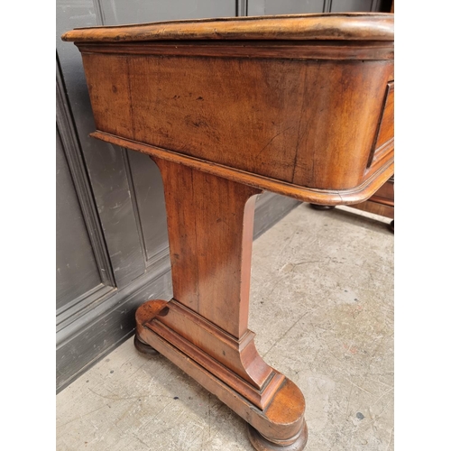 1064 - A Victorian mahogany writing table, 119.5cm wide.