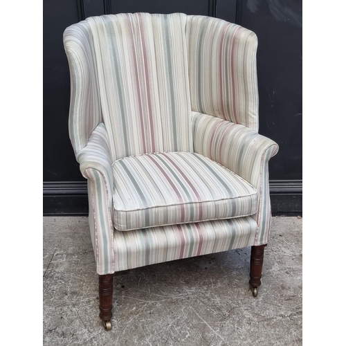 1070 - An antique mahogany wing armchair.