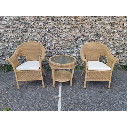 1082 - A pair of simulated wicker conservatory chairs and matching circular table, by Summer Castle, the ta... 