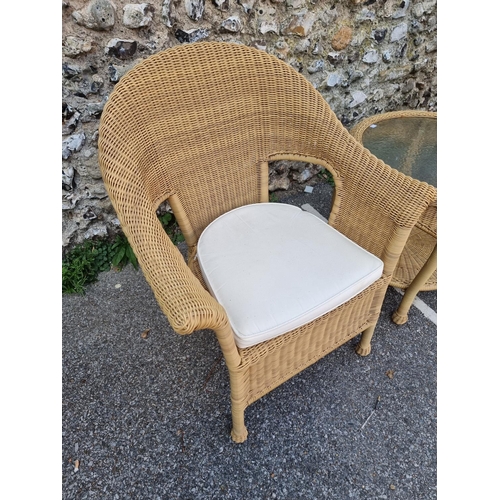 1082 - A pair of simulated wicker conservatory chairs and matching circular table, by Summer Castle, the ta... 