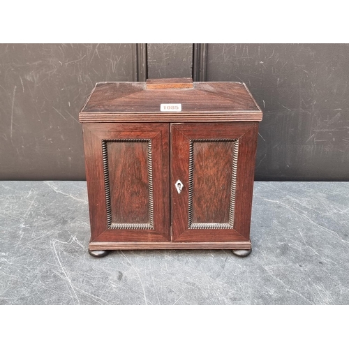 1085 - A small William IV rosewood table top collectors chest, each drawer labelled 'Grundy & Fox,... 