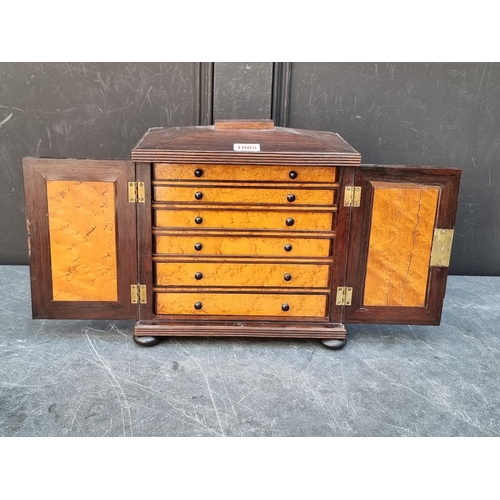 1085 - A small William IV rosewood table top collectors chest, each drawer labelled 'Grundy & Fox,... 