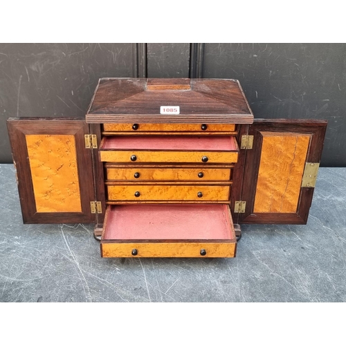 1085 - A small William IV rosewood table top collectors chest, each drawer labelled 'Grundy & Fox,... 