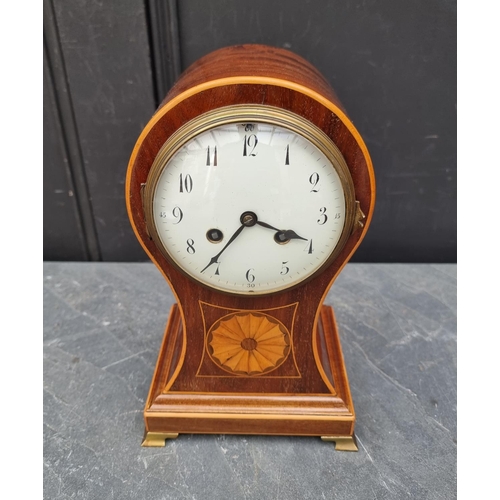 1102 - A circa 1900 mahogany and inlaid balloon form mantle clock, 29cm high, with pendulum.... 