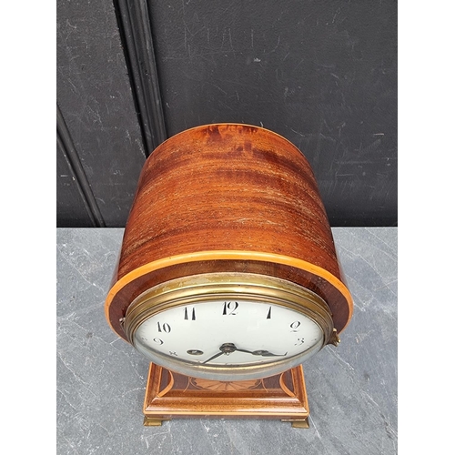 1102 - A circa 1900 mahogany and inlaid balloon form mantle clock, 29cm high, with pendulum.... 