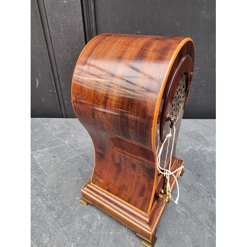 1102 - A circa 1900 mahogany and inlaid balloon form mantle clock, 29cm high, with pendulum.... 