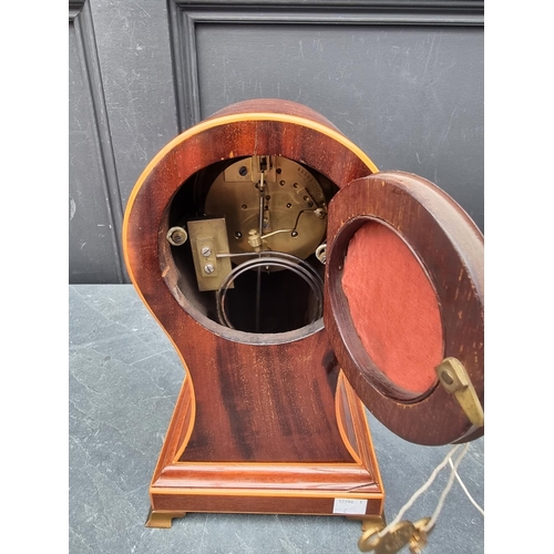 1102 - A circa 1900 mahogany and inlaid balloon form mantle clock, 29cm high, with pendulum.... 