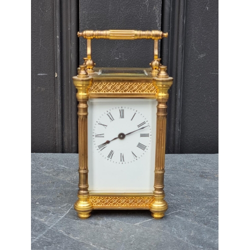 1104 - An antique French gilt brass carriage timepiece, height including handle 15.5cm.... 