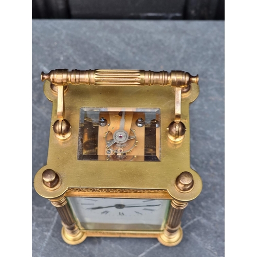 1104 - An antique French gilt brass carriage timepiece, height including handle 15.5cm.... 