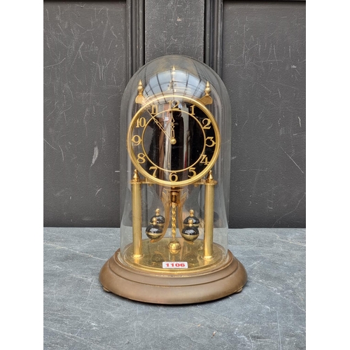 1106 - A brass anniversary clock, with glass dome, 29cm high.