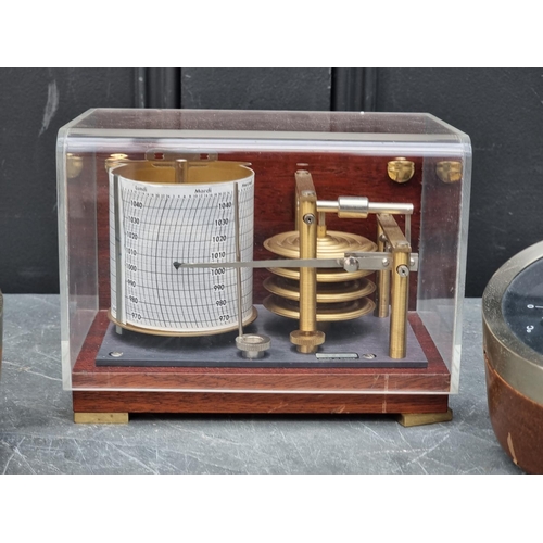 1108 - A small barograph, by Plastimo, 17.5cm wide; together with a barometer set, by Taylor, 12cm dia... 