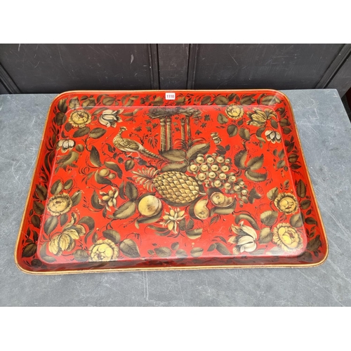 1110 - A good graduated pair of 19th century papier mache trays, with gilt decoration on a scarlet red grou... 