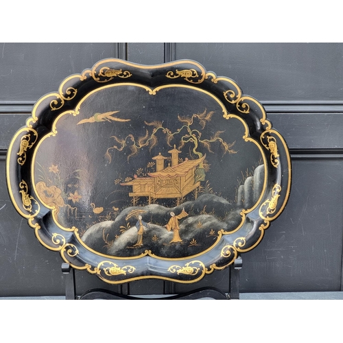 1110A - A good 19th century chinoiserie papier mache tray, by Jennens & Bettridge, 64cm wide, on ebonise... 