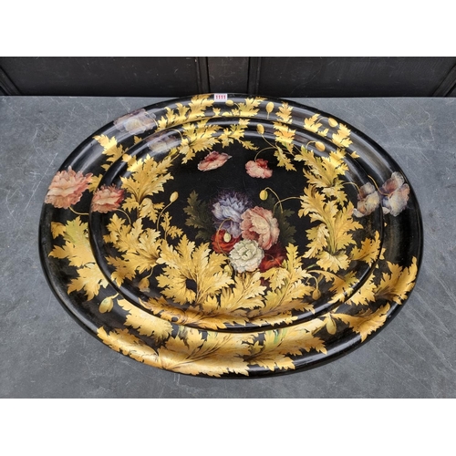 1111 - A good graduated pair of 19th century papier mache oval trays, with painted and gilded decoration, l... 