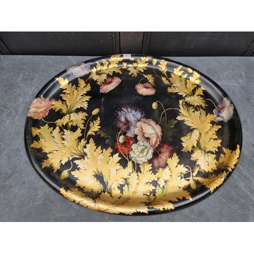 1111 - A good graduated pair of 19th century papier mache oval trays, with painted and gilded decoration, l... 