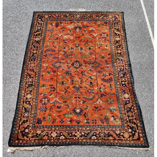 1116 - A Persian rug, having floral and geometric central field, 296 x 202cm.