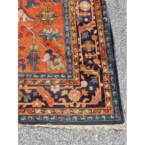 1116 - A Persian rug, having floral and geometric central field, 296 x 202cm.