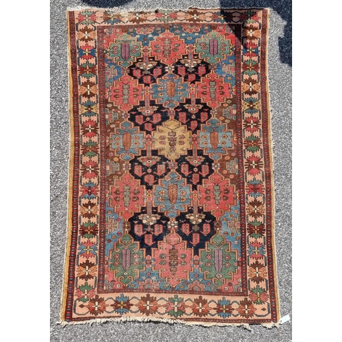 1117 - A Persian rug, having geometric central field, with star borders, 201 x 131.