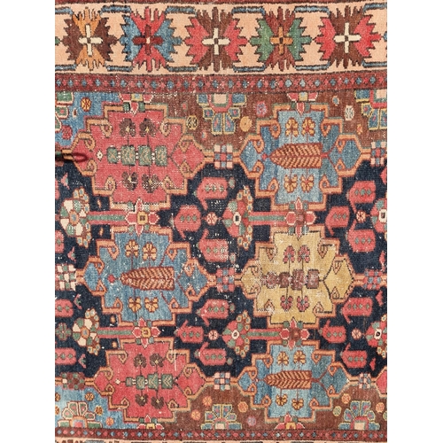 1117 - A Persian rug, having geometric central field, with star borders, 201 x 131.