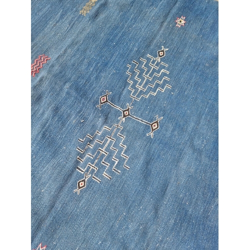 1118 - A Moroccan flat weave rug, on blue ground, 249 x 167.