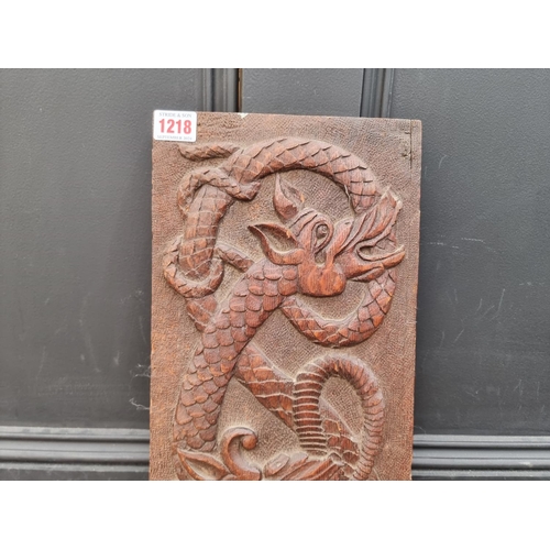 1218 - An old oak relief carved dragon panel, possibly Welsh, 20 x 84cm. 