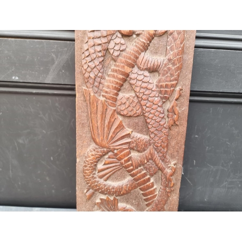 1218 - An old oak relief carved dragon panel, possibly Welsh, 20 x 84cm. 