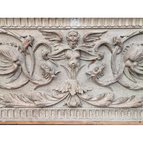 1219 - A Renaissance style relief carved pine panel, 28.5 x 69.5cm. 