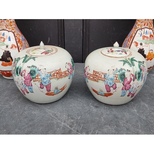 1221 - A large pair of Japanese Kutani vases, 39cm high, (one repaired); together with two smaller Japanese... 