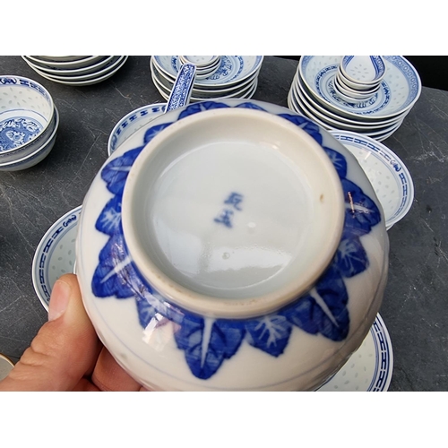 1224 - A Chinese blue and white porcelain part service; together with four Japanese cups. ... 