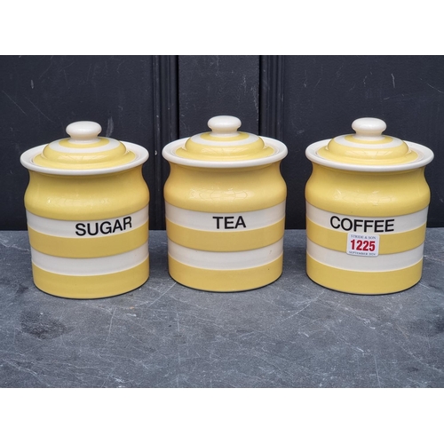 1225 - Three T G Green yellow Cornishware storage jars and covers, 16.5cm high.