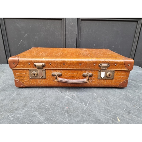 1243 - A vintage simulated crocodile suitcase, 55.5cm wide.