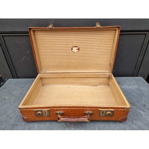 1243 - A vintage simulated crocodile suitcase, 55.5cm wide.