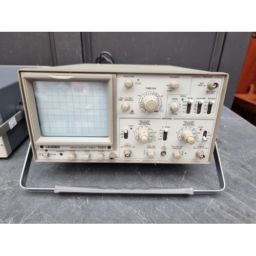 1247 - A Leader 1021 Oscilloscope; together with a similar Advance OS140 example, each with power lead; and... 