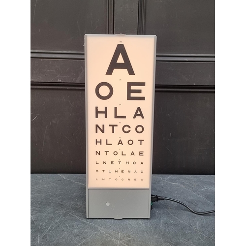 1249 - A Optometrist's illuminated eye chart, 58.5cm high, with power cable.