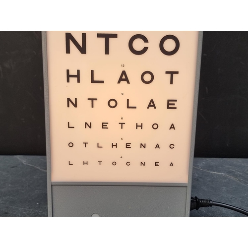 1249 - A Optometrist's illuminated eye chart, 58.5cm high, with power cable.