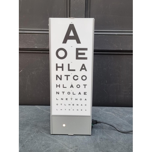 1249 - A Optometrist's illuminated eye chart, 58.5cm high, with power cable.