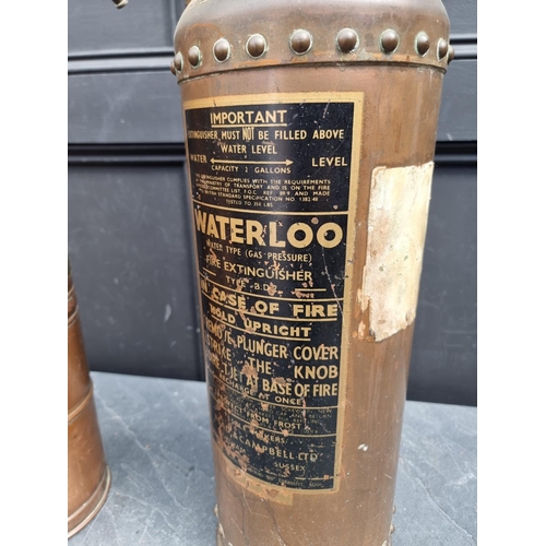 1250 - A vintage 'Waterloo' copper fire extinguisher, 59cm high; together with another vintage copper garde... 