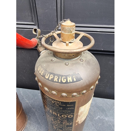 1250 - A vintage 'Waterloo' copper fire extinguisher, 59cm high; together with another vintage copper garde... 