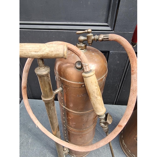 1250 - A vintage 'Waterloo' copper fire extinguisher, 59cm high; together with another vintage copper garde... 