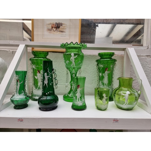 1251 - A group of Victorian Mary Gregory style green glass and others similar, largest 31.5cm high. (19)... 