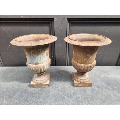 1270 - A small pair of cast iron Campana urns, 31.5cm high.