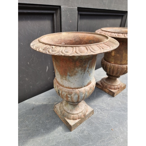 1270 - A small pair of cast iron Campana urns, 31.5cm high.